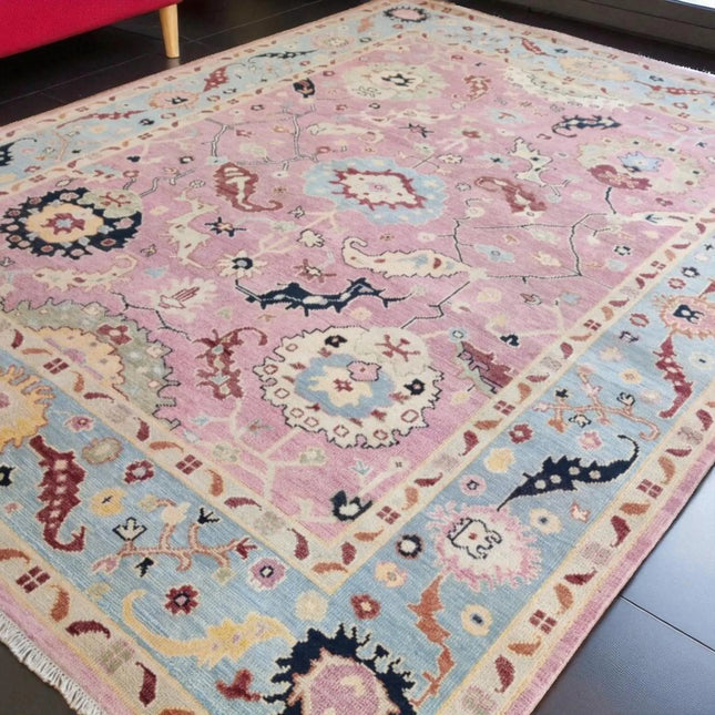 Hand-Knotted Oushak Wool Rug: Pink Turkish Floral Area Rug