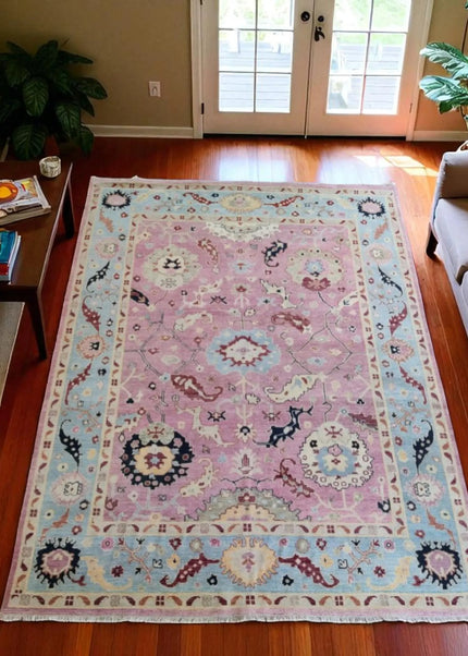 Hand-Knotted Oushak Wool Rug: Pink Turkish Floral Area Rug