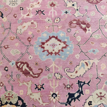 Hand-Knotted Oushak Wool Rug: Pink Turkish Floral Area Rug