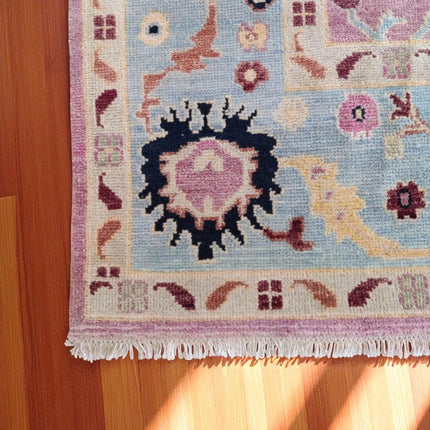 Hand-Knotted Oushak Wool Rug: Pink Turkish Floral Area Rug