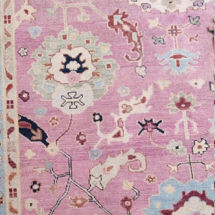 Hand-Knotted Oushak Wool Rug: Pink Turkish Floral Area Rug